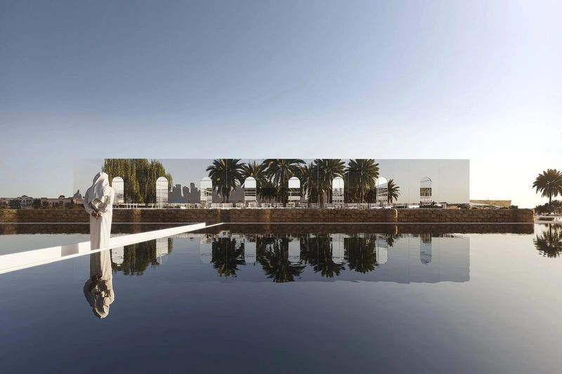 Jumeirah Archaeological Square · Jumeirah — the pavilion reflected in still water, a visitor at the edge
